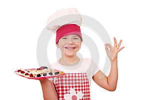 Litle girl with crepes on plate and ok hand sign
