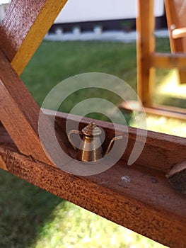 Litle teapot on wooden stall