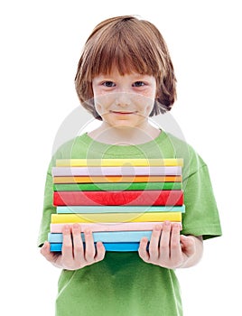 Litlle boy with freckles holding books