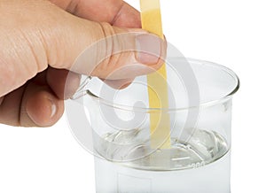 Litmus paper and beaker