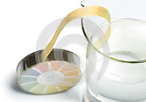 Litmus paper and beaker