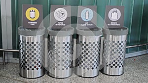 Litter bins with plastic, glass and paper sorting. Garbage distribution. Sorting garbage at the airport. Trash bin. Waste sorting