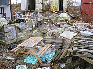 Littered place full with garbage in nature