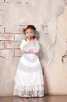 Little actress. Beautiful african girl shows emotions: fear, fright, surprise