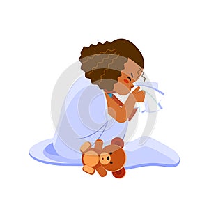 Little african american girl has flu, child sneezes into a handkerchief. Sick child girl sitting in bed with toy bear photo