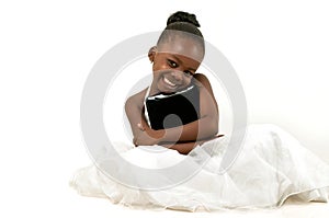 Little african american girl holding a digital tab