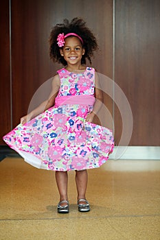 Little african-american girl modeling on runway