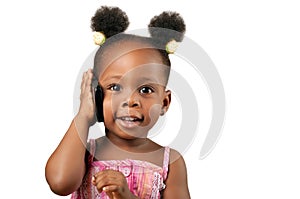 Little african american girl talking to the phone