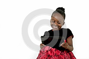 Little african american girl using a digital table