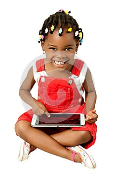 Little African American girl using tablet pc