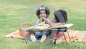 Little african boy and girl playing in backyard