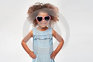 Little african girl in heart shaped sunglasses