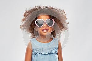 Little african girl in heart shaped sunglasses