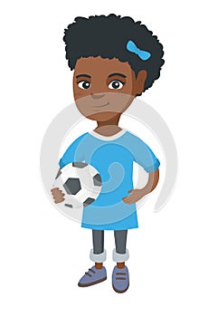 Little african girl holding a football ball.