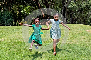 Little African girls running in the garden
