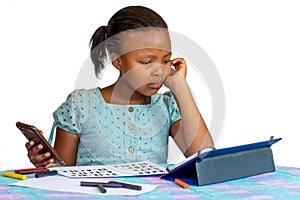 Little African kid struggling with maths homework