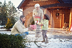 Little afro American child parents give Christmas presents