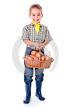 Little agriculturist holding onions