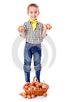 Little agriculturist holding onions