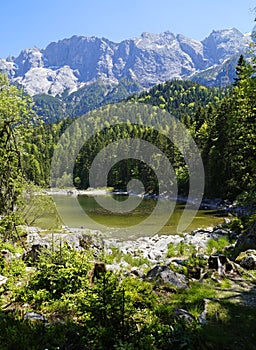 little alpine lake near lake Eibsee by foot of mountain Zugspitze in Bavaria (Garmisch-Partenkirchen, Germany)