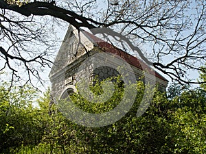 Little ancient church in green oasis