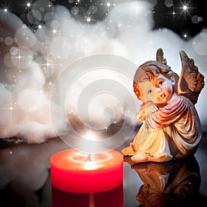 Little angel with candle