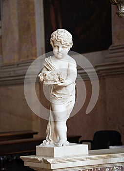 Little angel made of marble with flowers