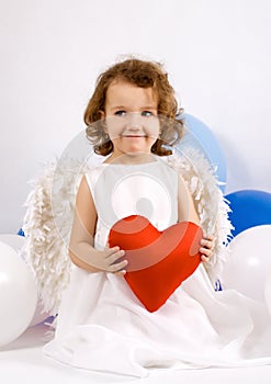 A little angel with red heart