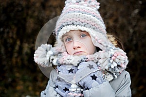 Little angry girl portrait outside