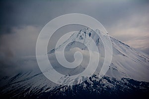 Little Ararat is covered in snow. Clouds over Mount Ararat