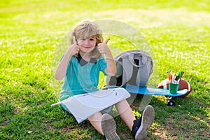 Little artist drawing painting art in park. Child learning outside in the nature park. Relaxation and childhood concept