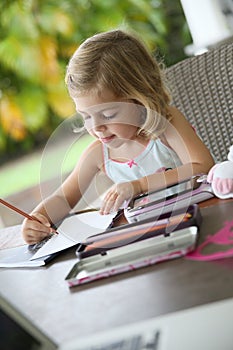 Little artist girl making drawings