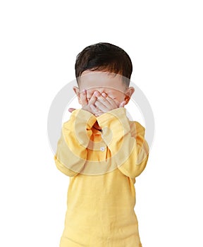 Little Asian baby boy covering eyes with hands isolated over white background