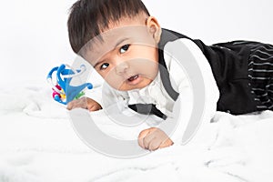 Little asian baby boy  play toy