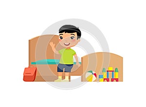 Little asian boy in clean bedroom flat vector illustration. Cute kid sitting on bed in tidy room cartoon character