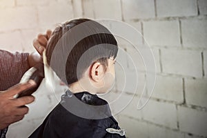 Little Asian Boy Cutting Hair, Copy Space