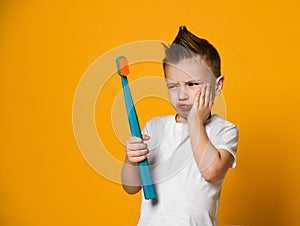 Little Asian boy suffering from toothache - Dental problem.