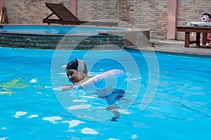 little asian boy swimming pool