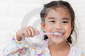 Little asian cute girl brush teeth photo