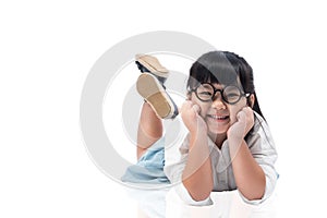 Little Asian cute girl laying on the floor isolated with clipping path.