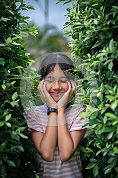 Little asian girl  fresh and natural, love green love nature Happiness amid nature