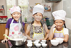 Little asian girl making cotton wool cake