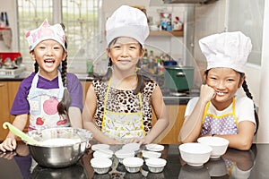 Little asian girl making cotton wool cake