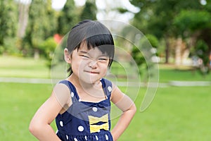 Little Asian girl in the park photo