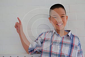 little asian kid boy child children schoolboy smiling & pointing