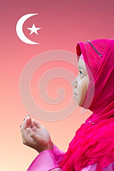 Little Asian Muslim kid girl in pink hijab Muslim scraft prayi