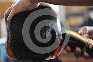 Little Asian Thai Boy cutting hair