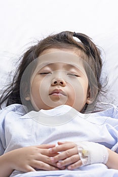 Little Asian Thai Girl, Recovering Sleep on white patient Bed Background