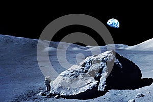 Little astronaut on the big moon. Elements of this image furnished by NASA