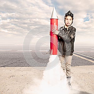 Little aviator holding a rocket